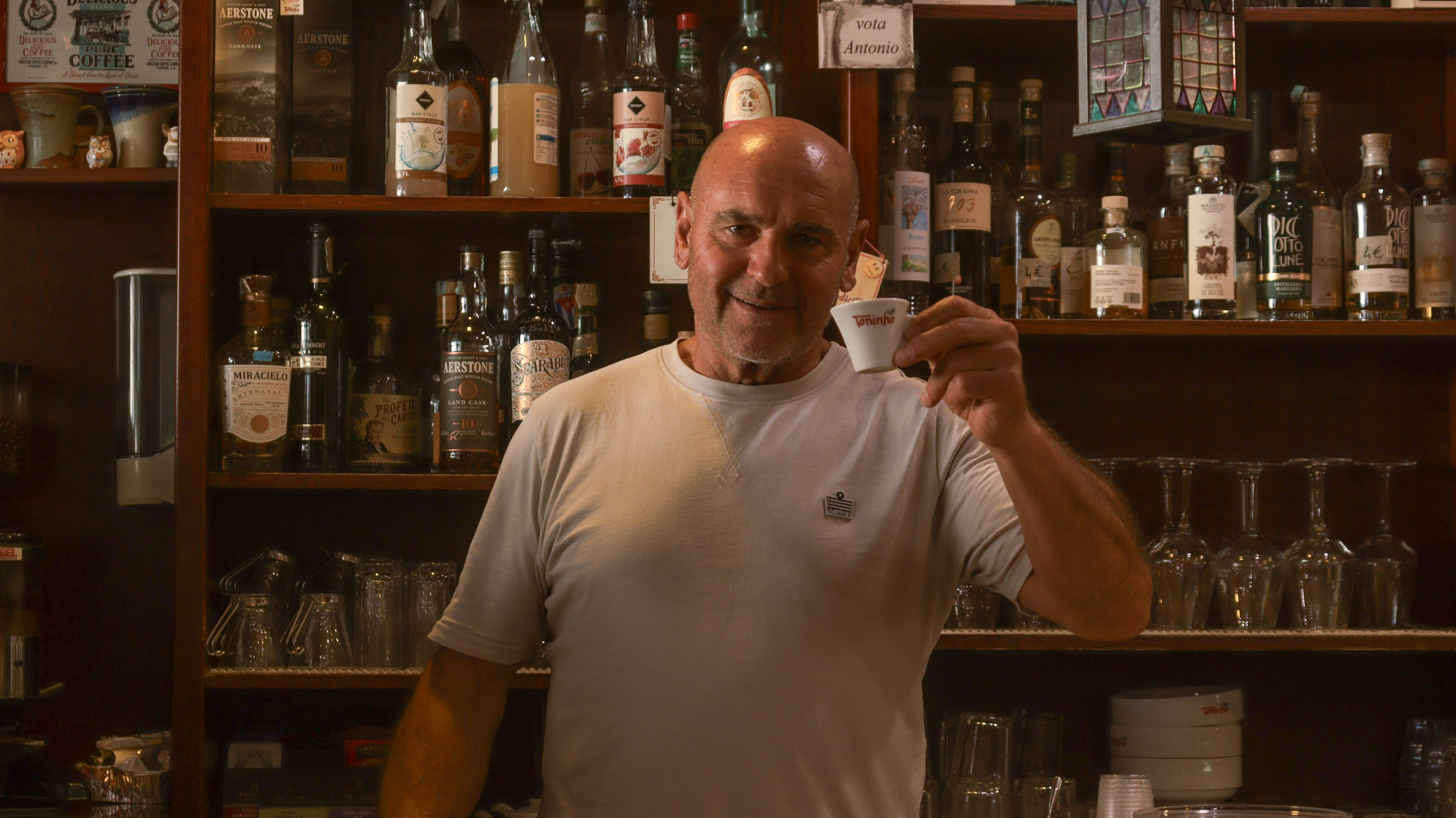 Smiling cafe owner small image